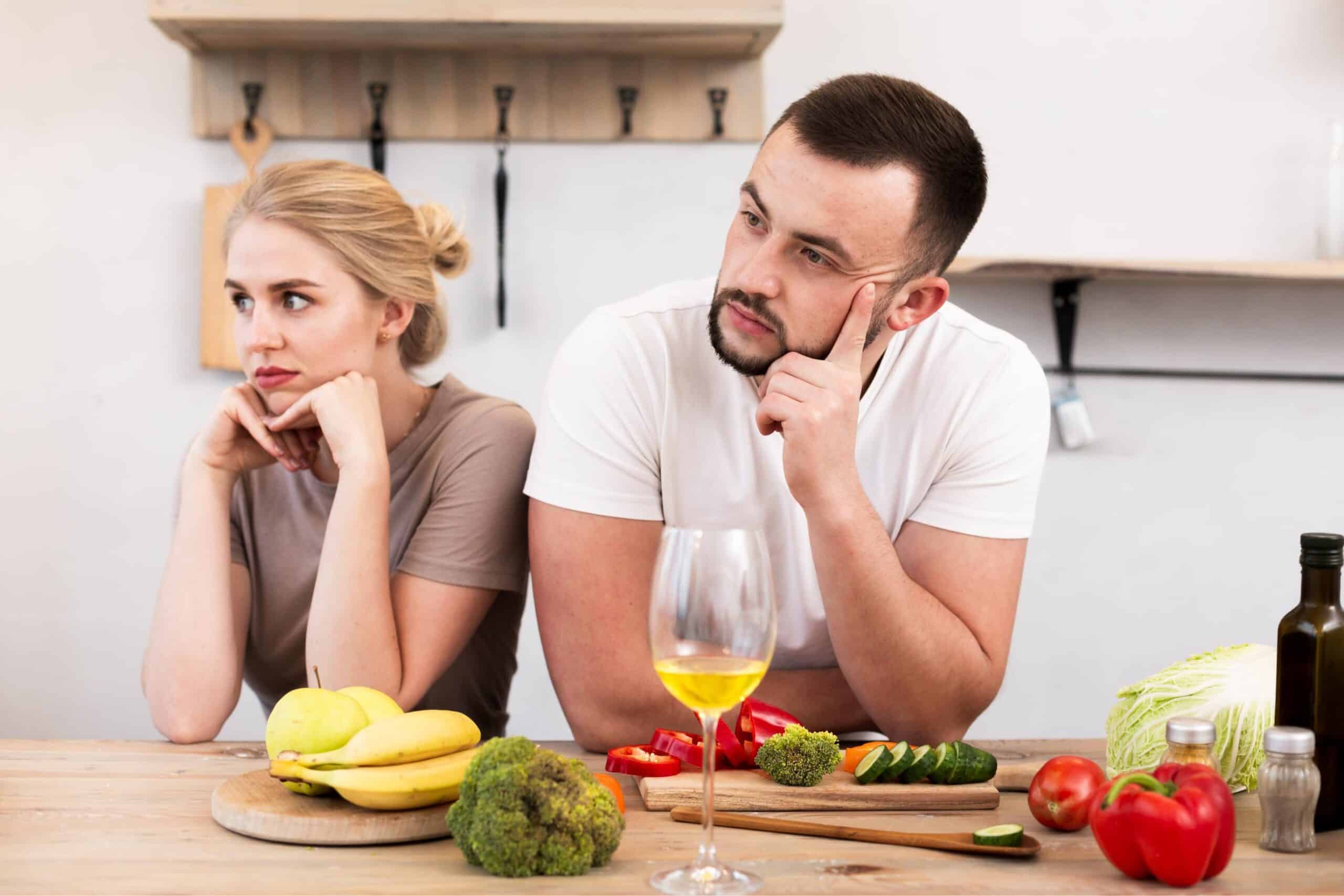 young couple thinking kitchen scaled