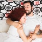 elevated view couple sleeping together bed
